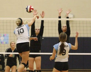Providence Catholic's Liza Ellingson (center) and Katie Compagno (right) go up to block a spike from Joliet Catholic's Madeline Grimm in Joliet on Thursday Oct. 23, 2014. | Mike Mantucca / For Sun-Times Media