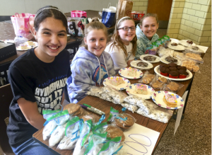 Mary Schuler and friends at their March JCA bake sale to raise awareness and funds for hydrocephalus.